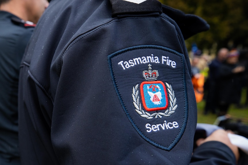 Tasmania Fire Service insignia on uniform.