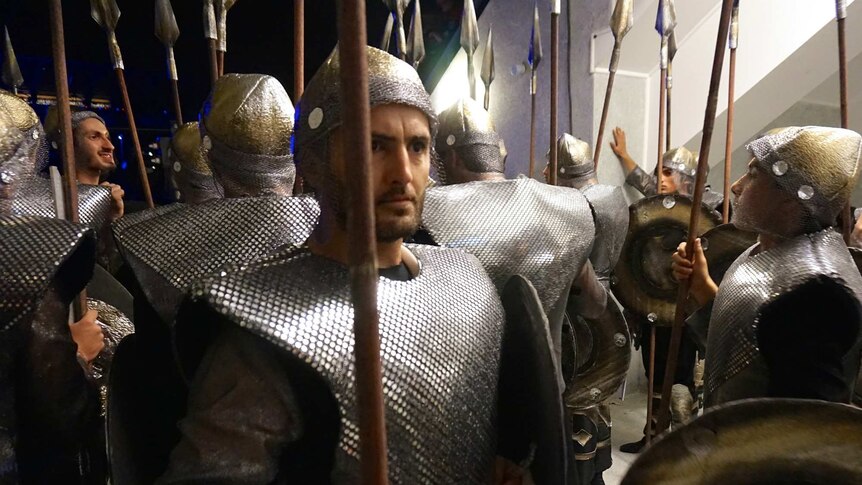 Men in medieval costumes.