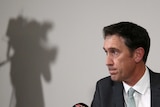 Cricket Australia chief executive James Sutherland looks on during a news conference