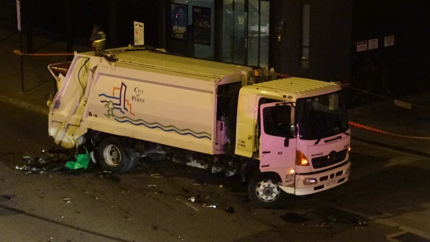 The garbage truck was damaged in the crash on Roe Street.