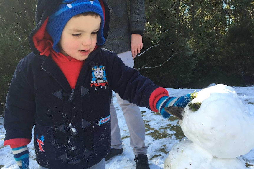 Building snowmen in Collinsville, Hobart