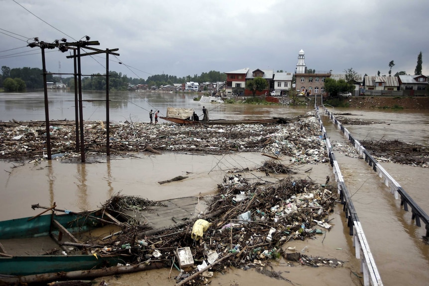 A channel floods after heavy rain in Srinagar, India