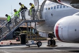 Passengers disembark a Virgin Australia flight at Kalgoorlie-Boulder Airport.  