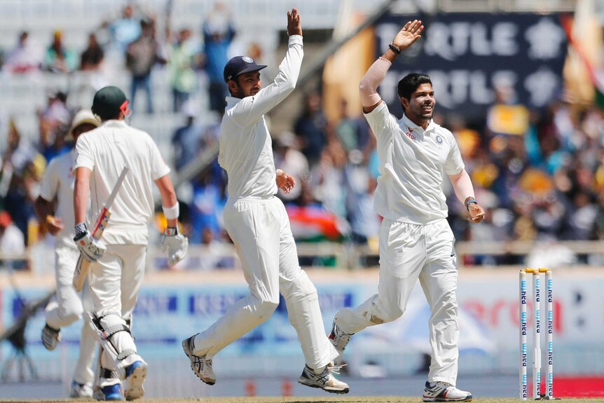 Umesh Yadav celebrates the wicket of Matt Renshaw