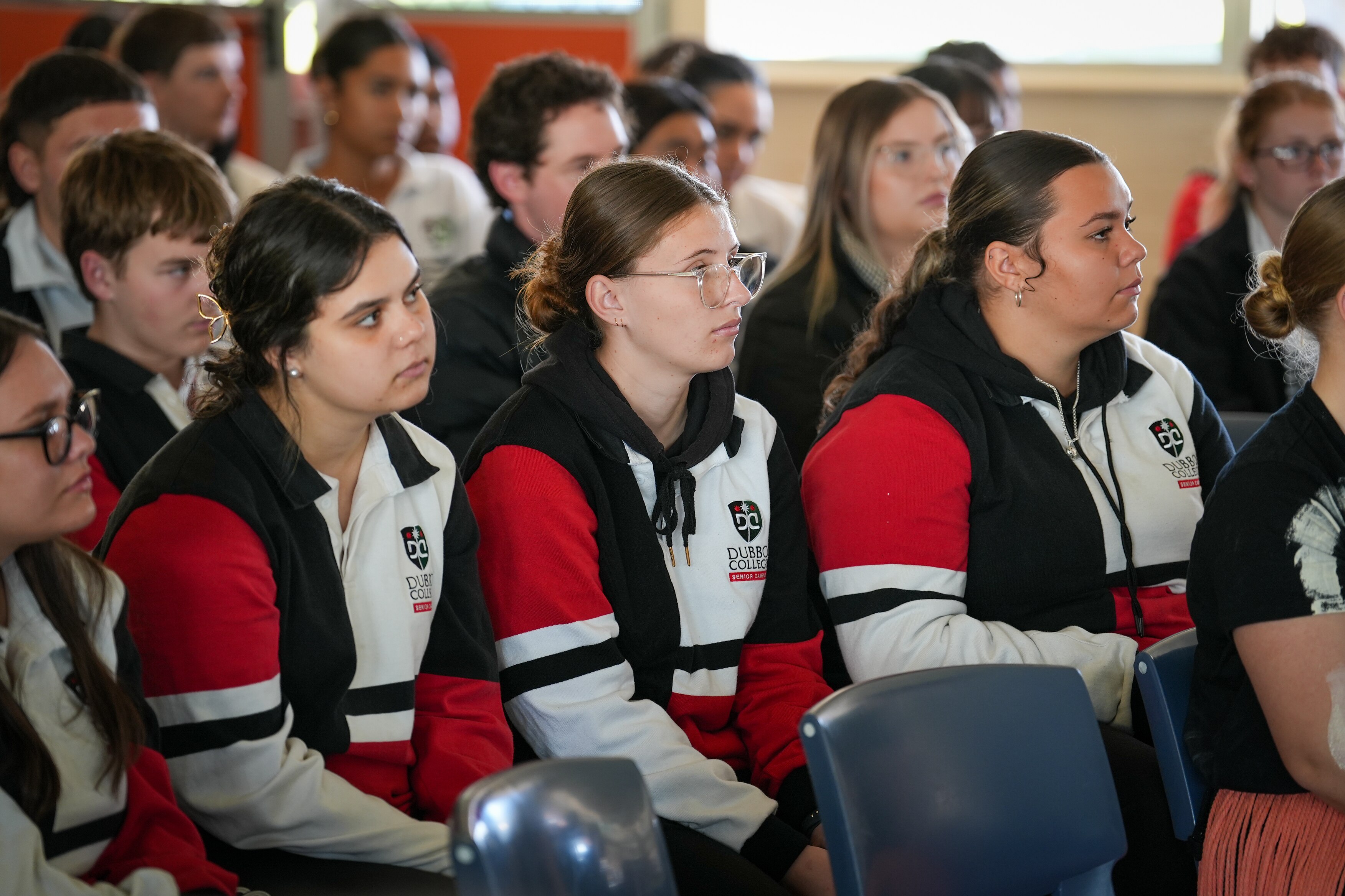 Dubbo College students sit in a group.