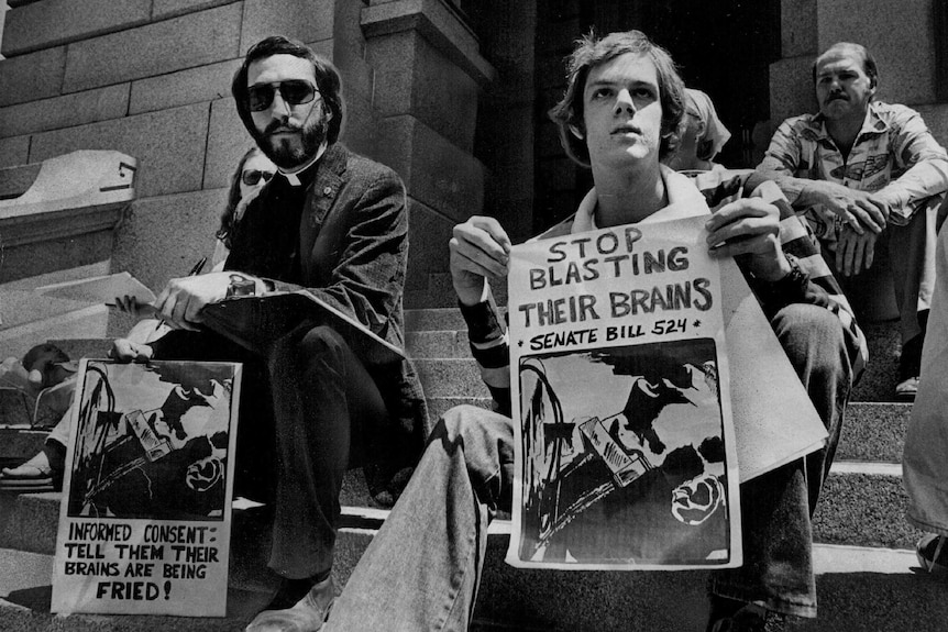 Black and white photograph of 1970s protesters of electroshock therapy.
