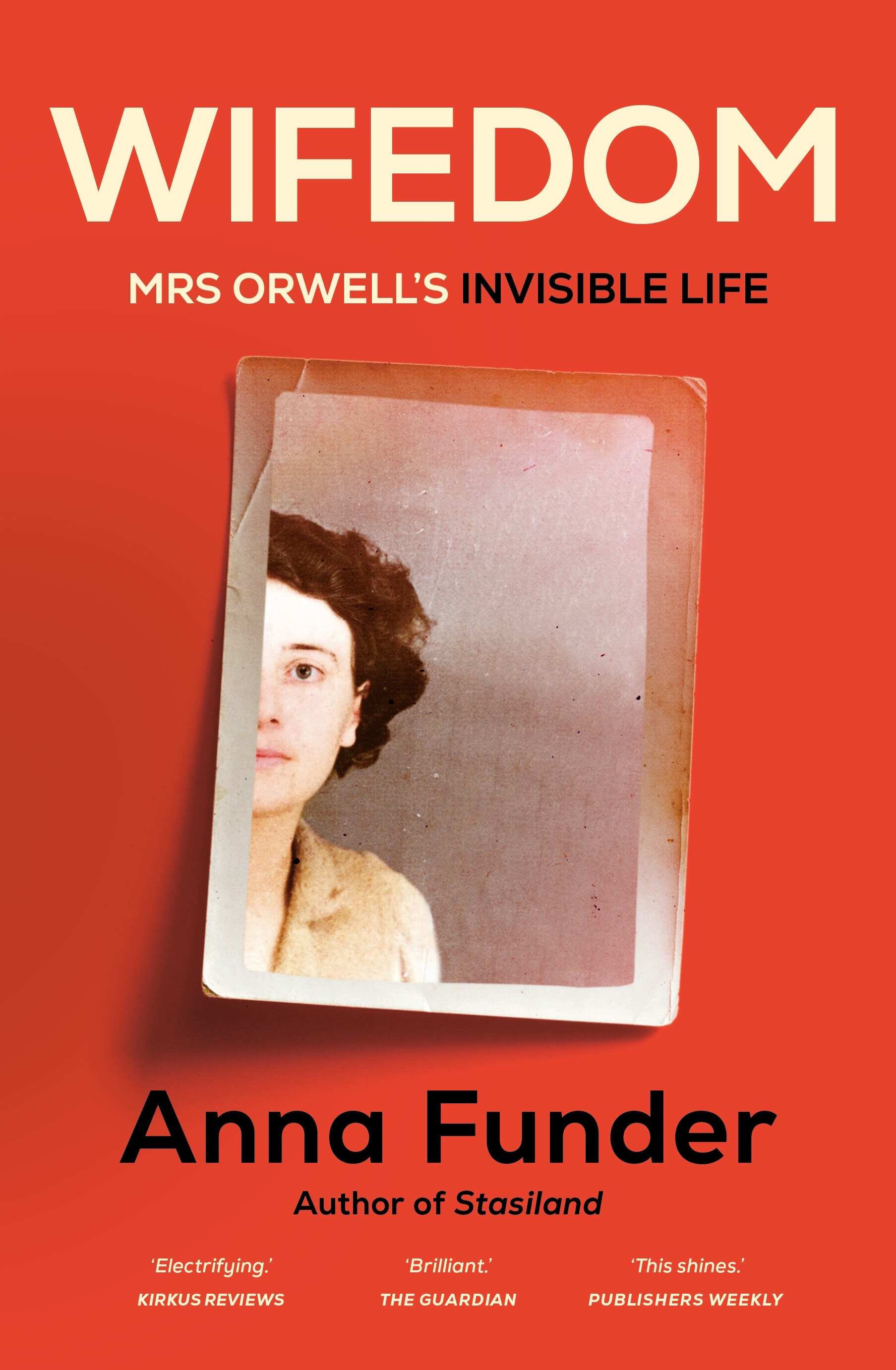 A book cover with an old photograph showing half of a young woman's face, on a red background