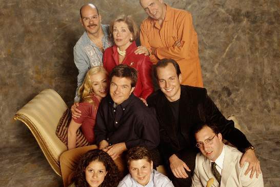 The cast of TV show Arrested Development sitting.