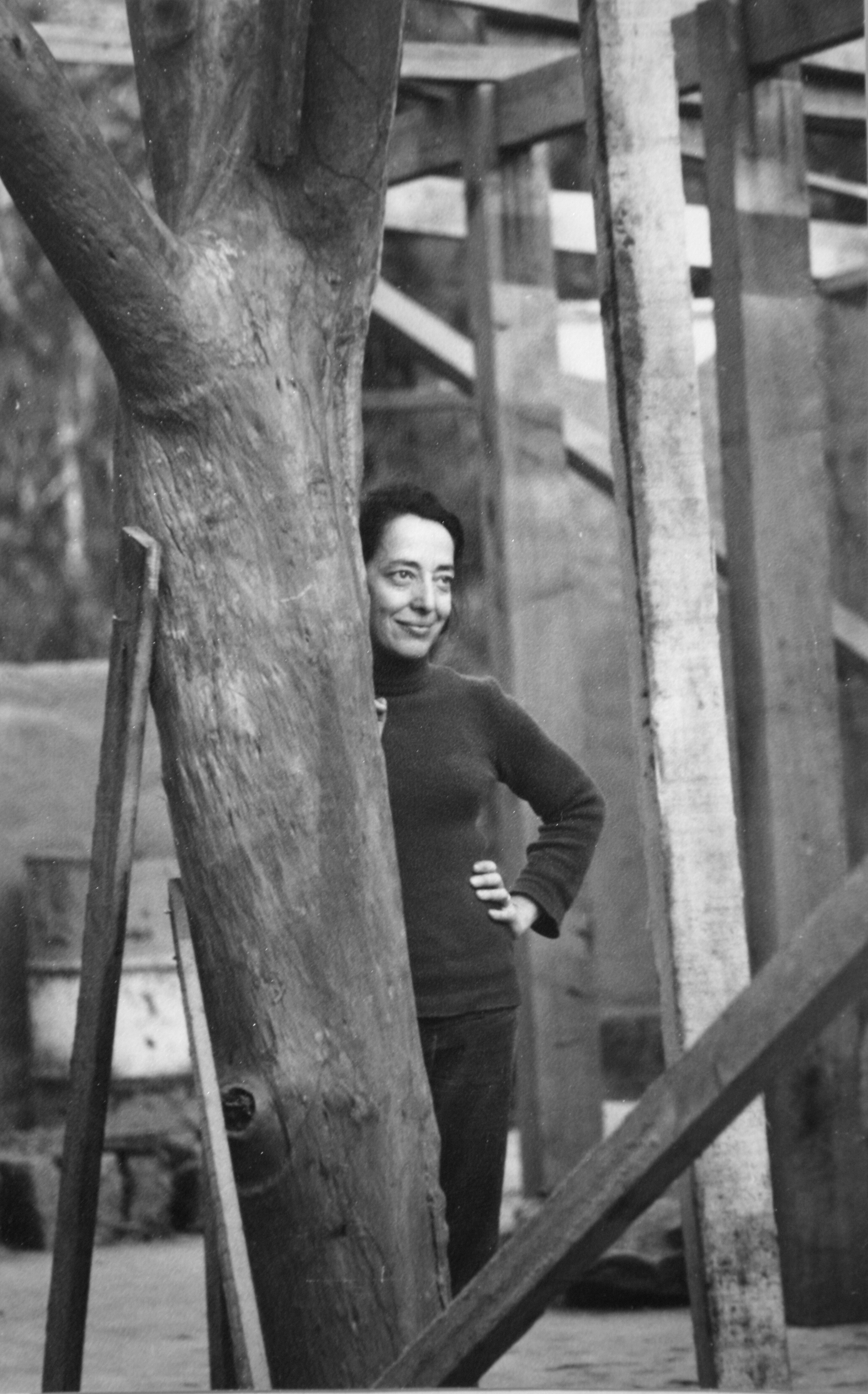 A black and white photo of a woman staring into the distance.