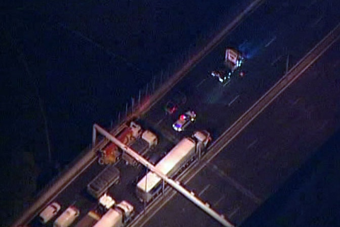 Aerial view of traffic stopped behind the prime mover on the Monash.