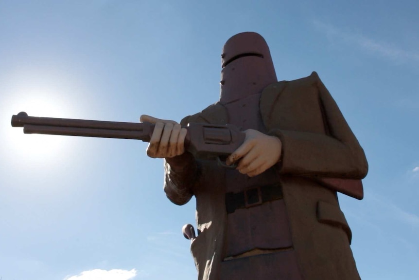 A large statue of Ned Kelly in his armour holding a gun