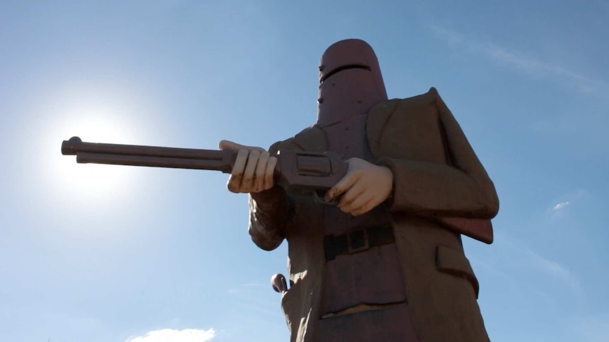 A large statue of Ned Kelly in his armour holding a gun