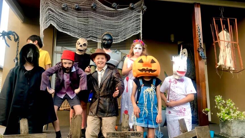 Severla kids in their halloween costumes.
