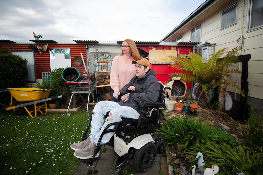 A man and a woman in a garden.