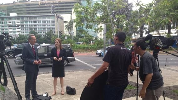 The ABC's Jim Middleton and Helen Brown filming in Jakarta