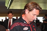 Bombers coach James Hird leaves a press conference