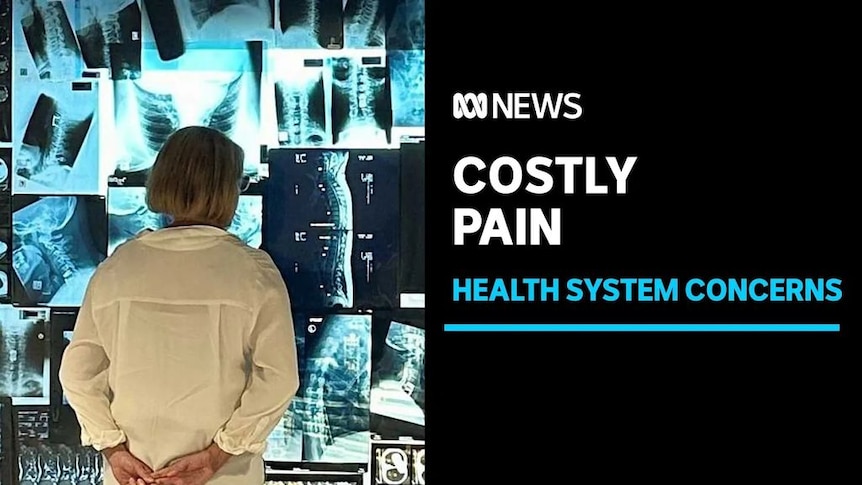 Costly Pain, Health System Concerns: A woman stands in front of a wall of x-ray results.
