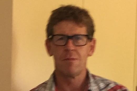 A photo of Michael Bowman, who is wearing glasses, has brown hair and an athletic build.