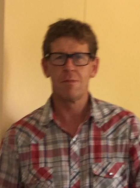A photo of Michael Bowman, who is wearing glasses, has brown hair and an athletic build.