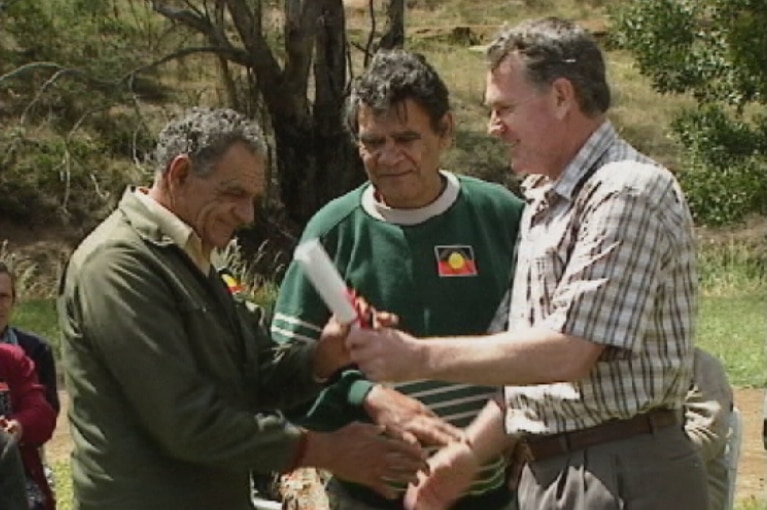 Premier Ray Groom hands over land deed in 1995