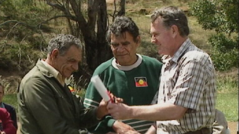 Premier Ray Groom hands over land deed in 1995