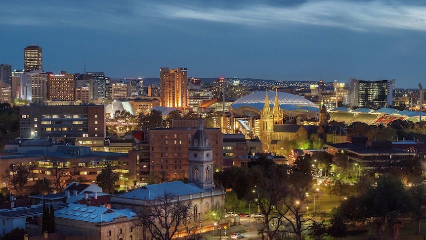 An aerial view across Adelaide CBD toward the hills beyond.