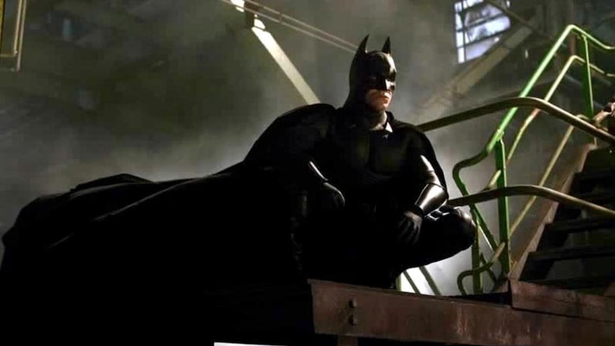 Christian Bale hanging up Batman cape - ABC News
