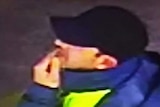 CCTV image of a man wearing a hat and reflective jacket that police wish to identify