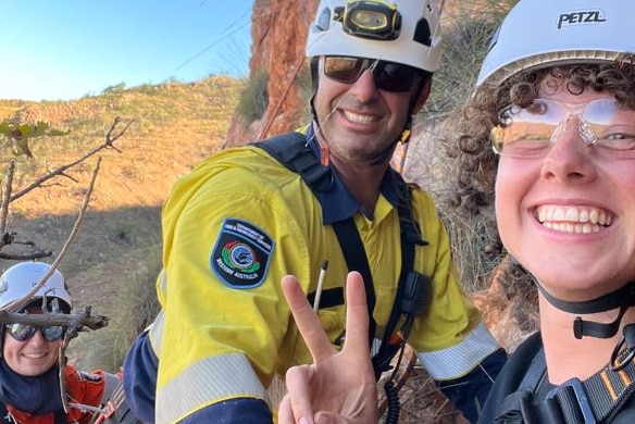 Alex Farrelly-Deas poses with the rescue crew who saved him