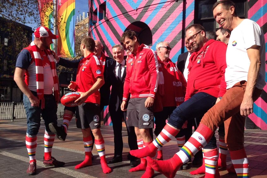 Sydney Swans players and supporters prepare for the first pride match