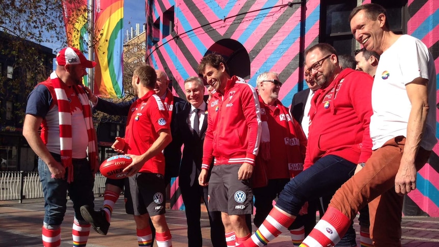 Sydney Swans players and supporters prepare for the first pride match