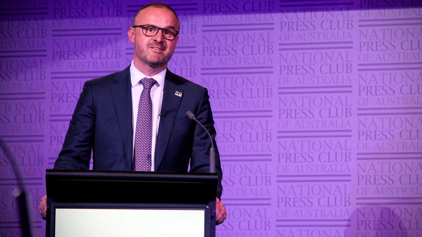 ACT Labor leader Andrew Barr stands at a podium at the National Press Club.