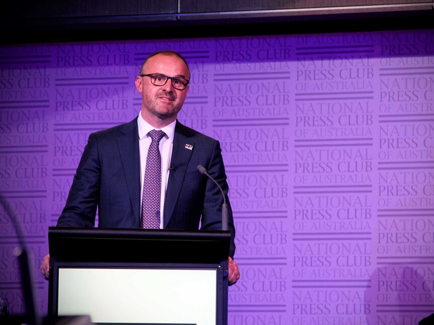 ACT Labor leader Andrew Barr stands at a podium at the National Press Club.
