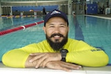 A swimming instructor in a pool