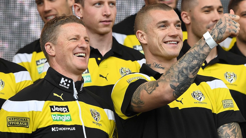 Dustin Martin and Damien Hardwick look at the crowd at the grand final parade.