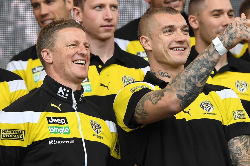 Dustin Martin and Damien Hardwick look at the crowd at the grand final parade.