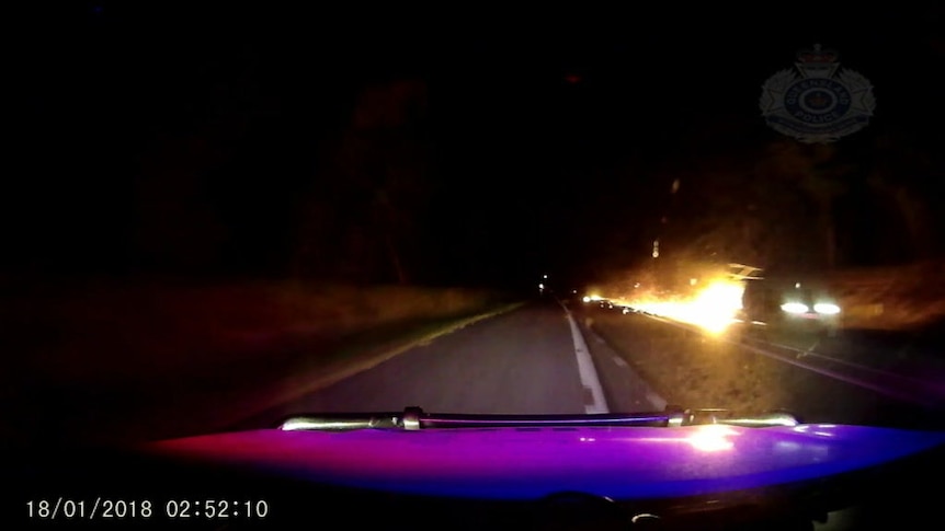 Police intercept driver with fiery trailer.