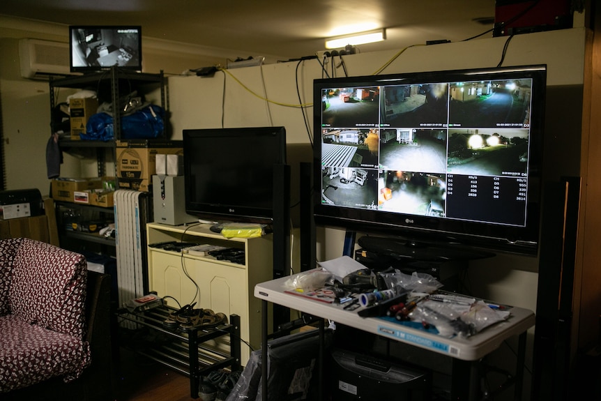 A monitor with multiple CCTV feeds.