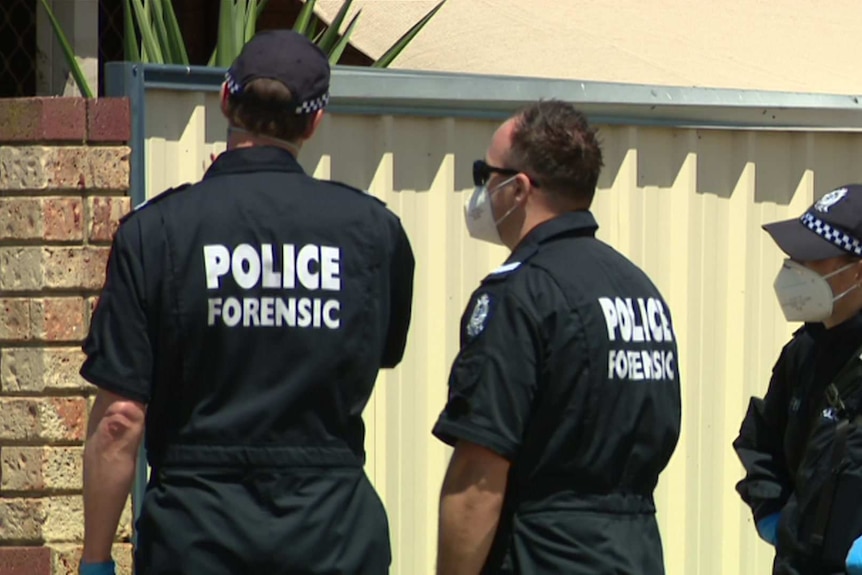 Three police officers in blue overalls with the word POLICE FORENSIC on the back.