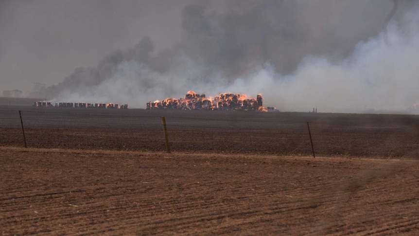 Hay bales on fire at property near Mallala