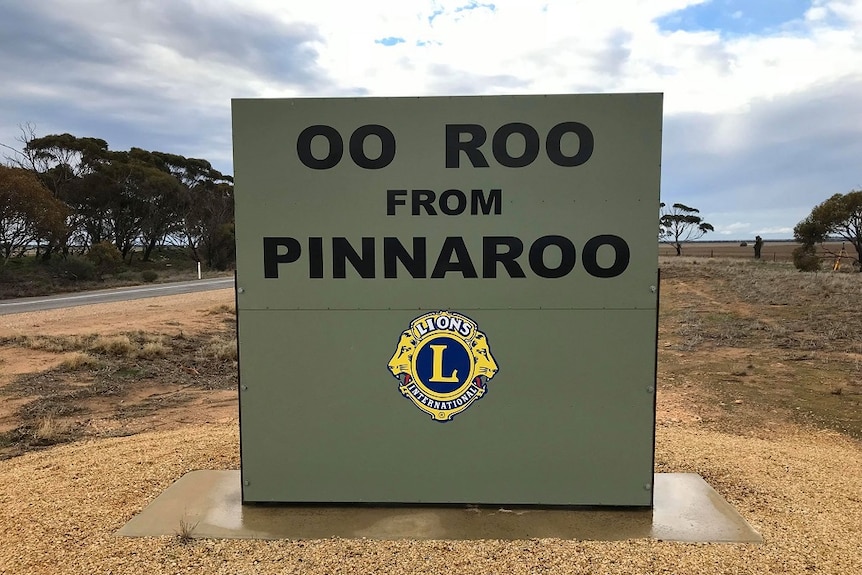 A green sign is on the side of a highway. It says ooroo from Pinnaroo.