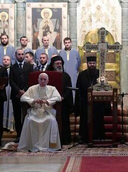 Pope Francis, left, sits next to Georgia's Orthodox Patriarch Ilia