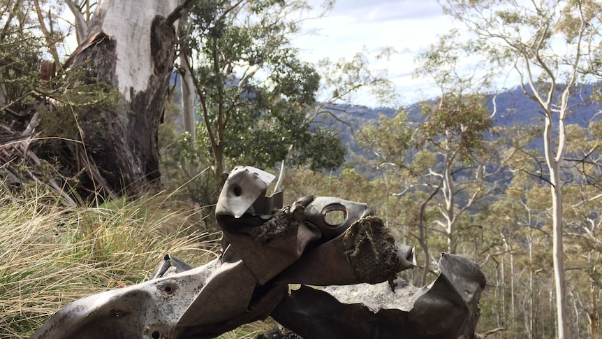 Pieces of plane wreckage on a mountain side in NSW
