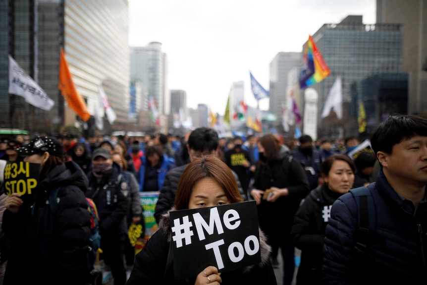 People attend a protest as a part of the #MeToo movement on the International Women's Day in Seoul