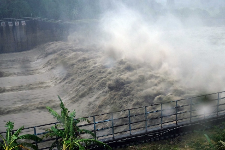 Churning waters in the Jhihtan Dam is seen in Xindian district.