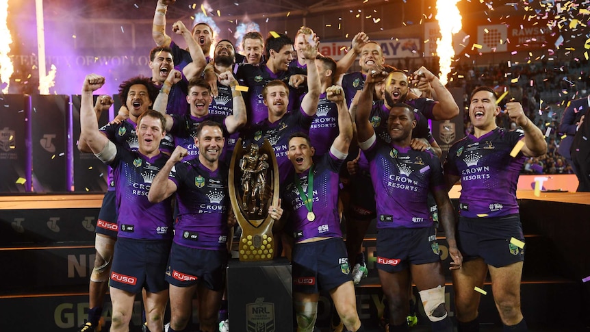 Melbourne Storm celebrate with the premiership trophy