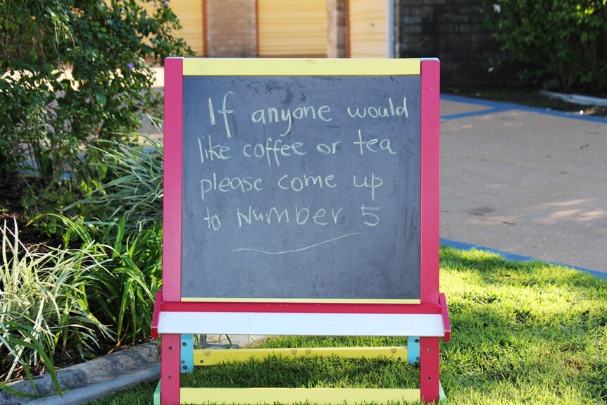 Sign saying: if anyone would like coffee or tea please come up to number 5.