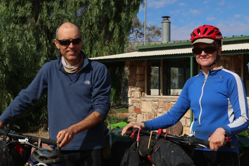 Cyclists Simon Cross and Solveigar Saule in William Creek