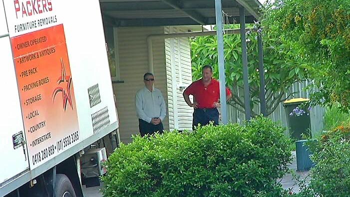 Paul Wilson (red shirt) at his mother's Tarragindi house with removalists.