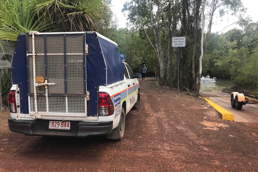 A police car parked at Leaders Creek during the hunt for a missing fisherman.